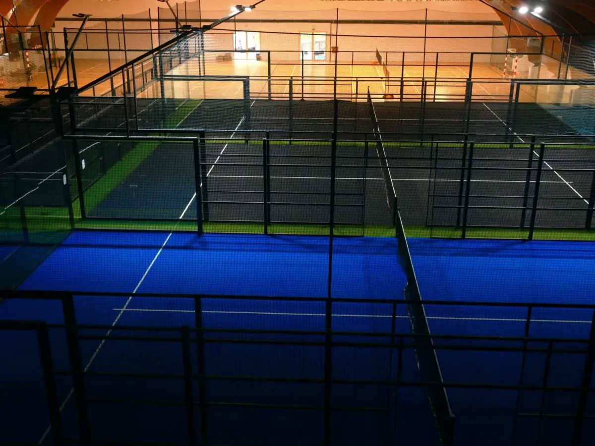 Indoor padel facility with multiple courts