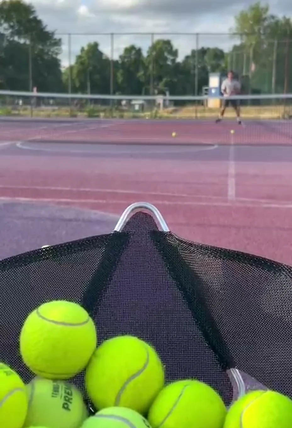 Sportbot ball basket facing the court during Rally Nights by BEYOND Berlin